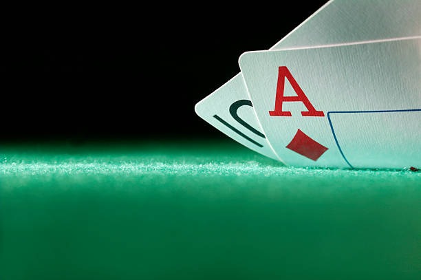 Casino Hold'em live dealer table with cards dealt and community cards visible